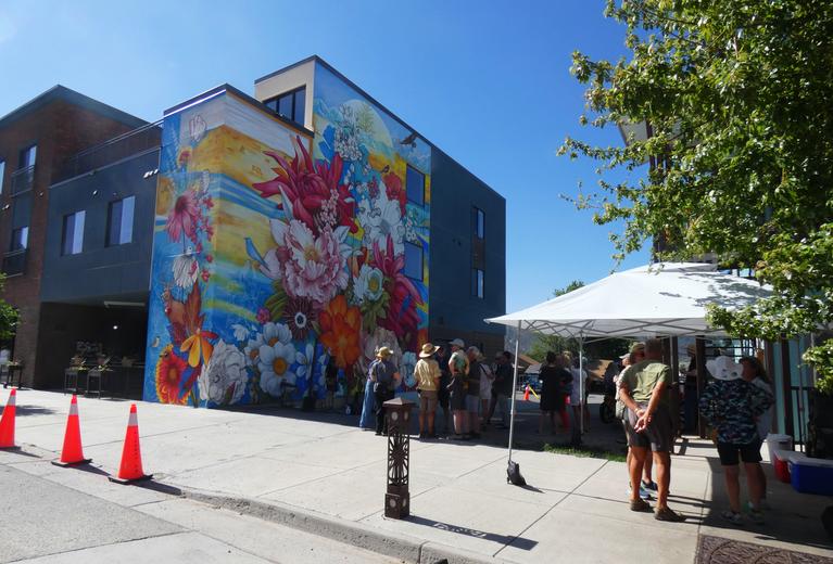 Ridgway's Space to Create building with mural of flowers and wildlife